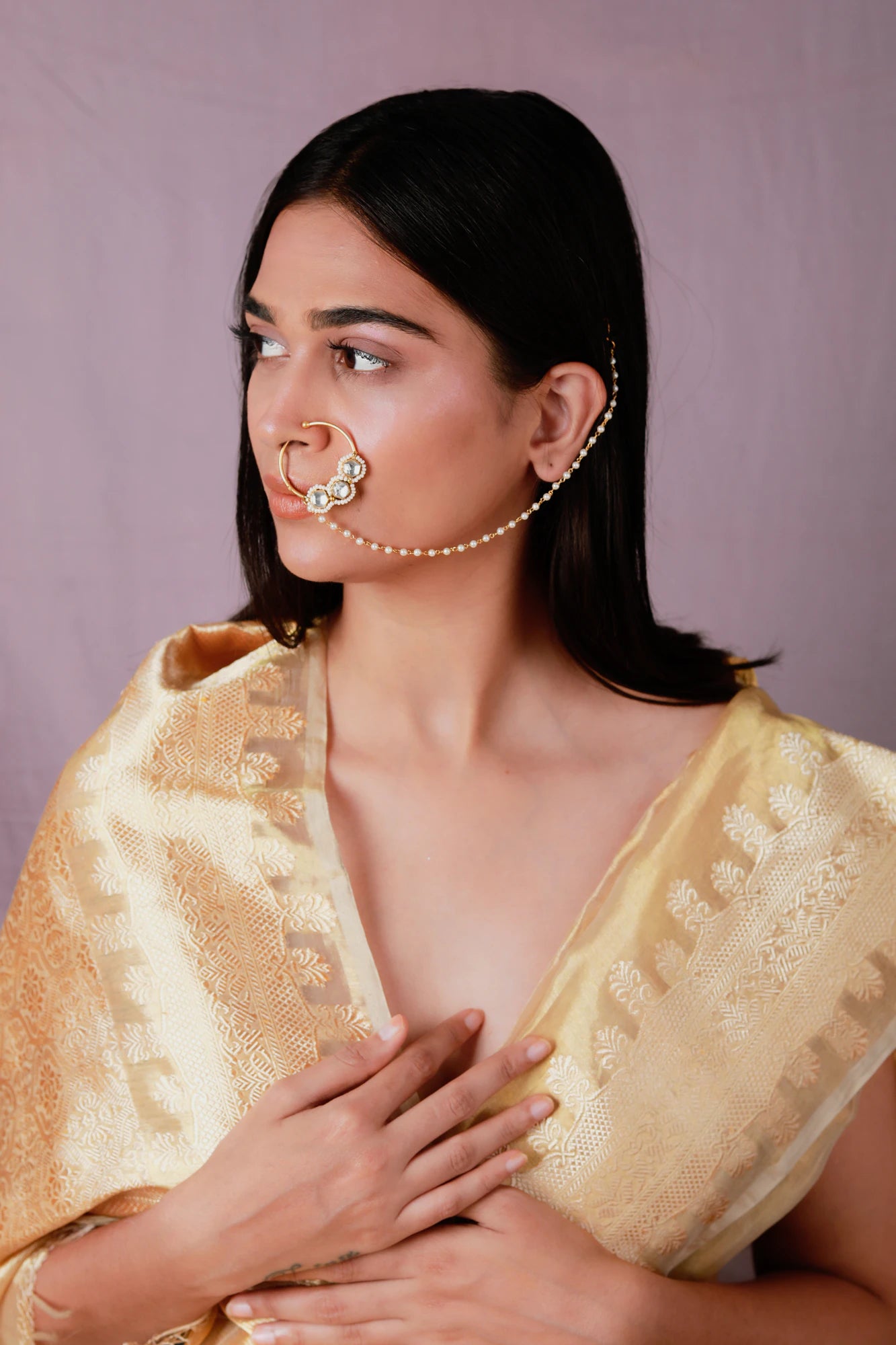 Gold toned white pearl beaded designer nath nose ring with chain