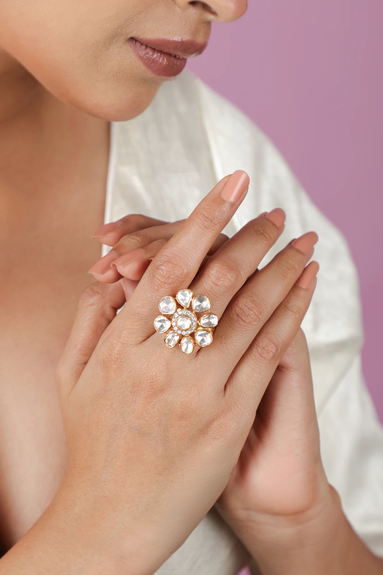 gold plated ring featuring a floral design with uncut moissanite stones