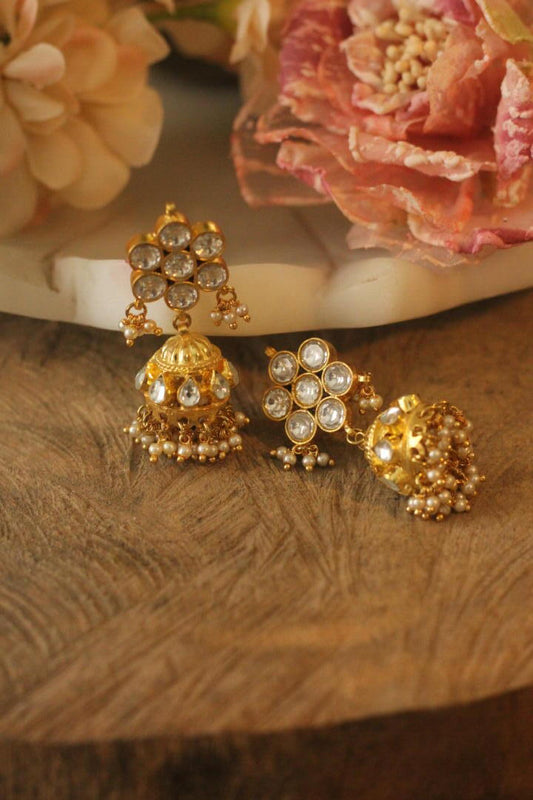 White floral studs with golden jhumki