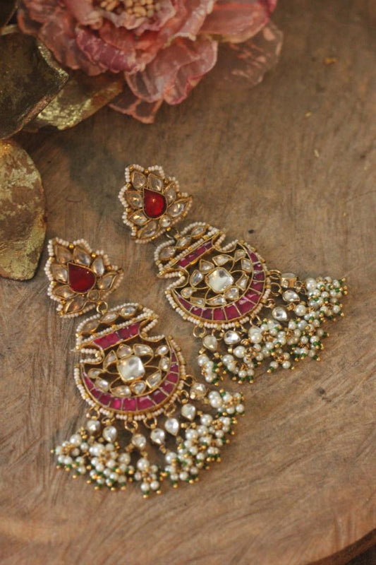 pink & white earrings with green hangings