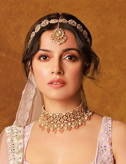 An Intricate Design Of Choker Necklace Studded With Mother Of Pearl Stones And Beaded With Pastel Pink Beads