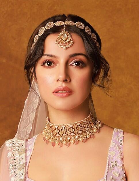 An Intricate Design Of Choker Necklace Studded With Mother Of Pearl Stones And Beaded With Pastel Pink Beads