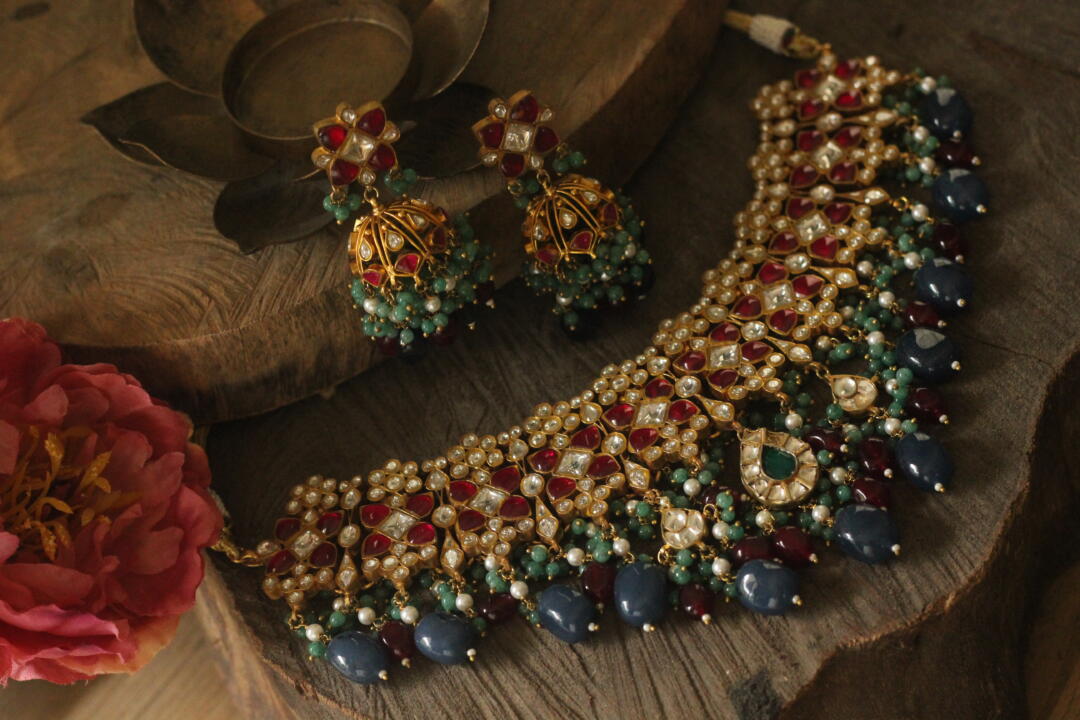 Pink stone necklace set with blue beads and jhumki