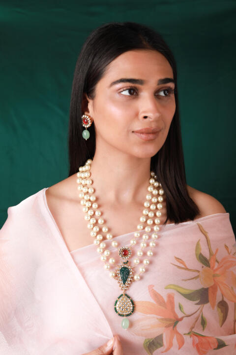 Gold plated white pearl necklace set with pink studs