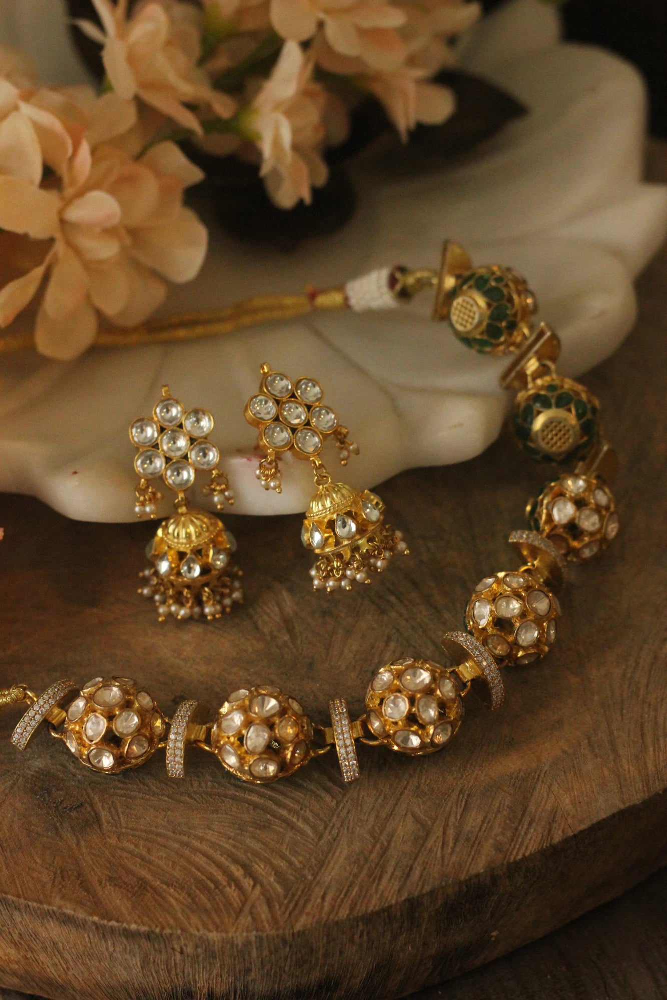 Reversible choker Necklace set in the combination of white mozanite stones and emeralds with cute jhumki earings