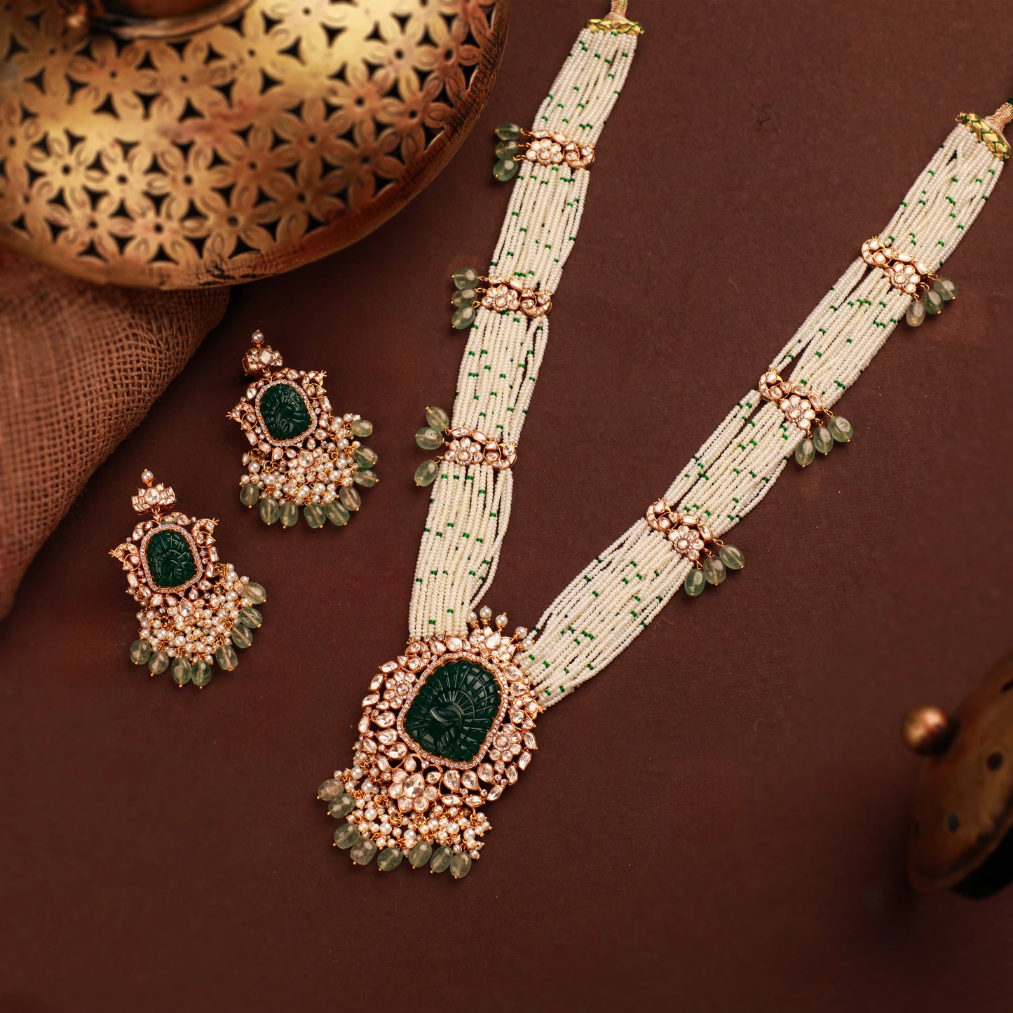traditional jadau maala with uniquely carved emerald stone in mozanite stones and pearl strings
