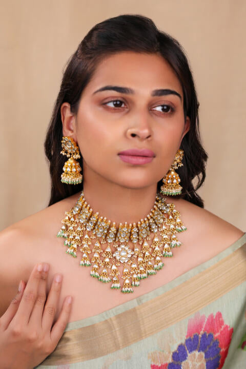 Heavy jadtar kundan set with pearl and jhumkis