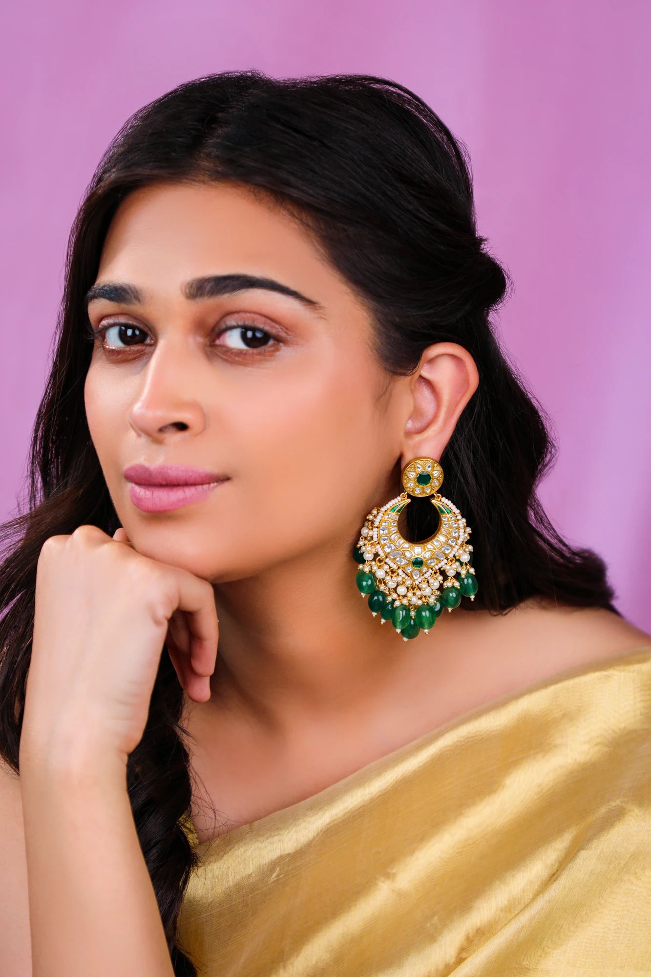 Artisan earings in jadau with emerald stone and beads