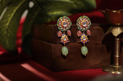 Delicate stud earings with pastel green drops