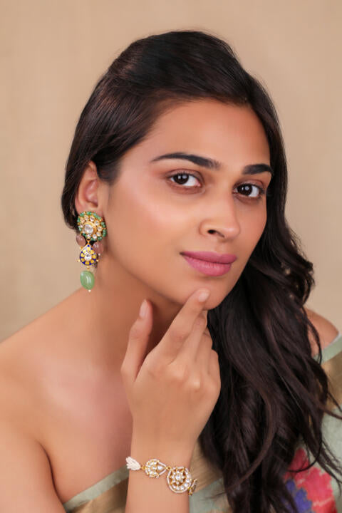 Delicate stud earings with pastel green drops