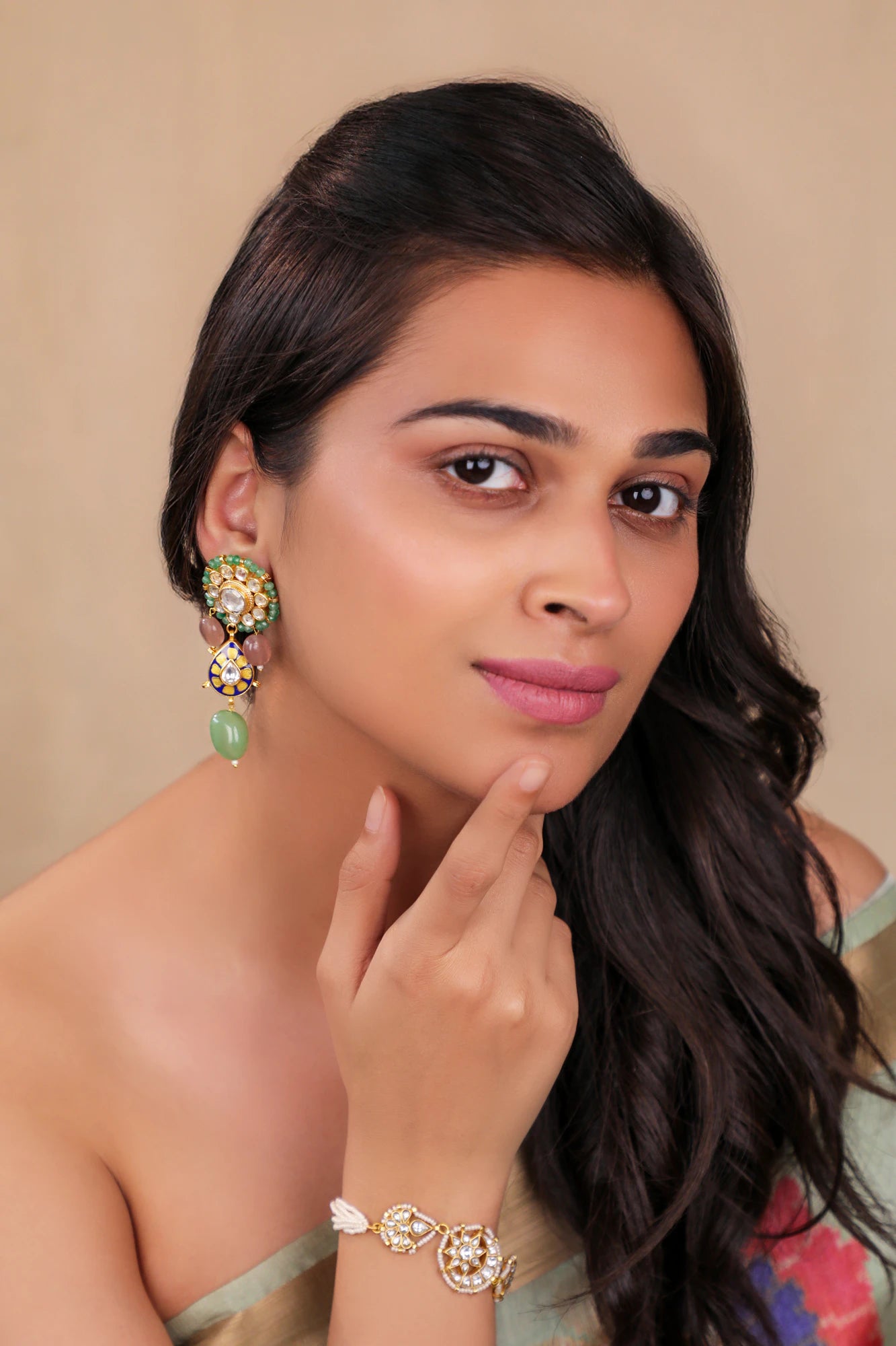 Delicate stud earings with pastel green drops