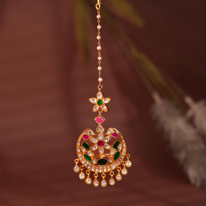 green floral with green sttone work maangtikka