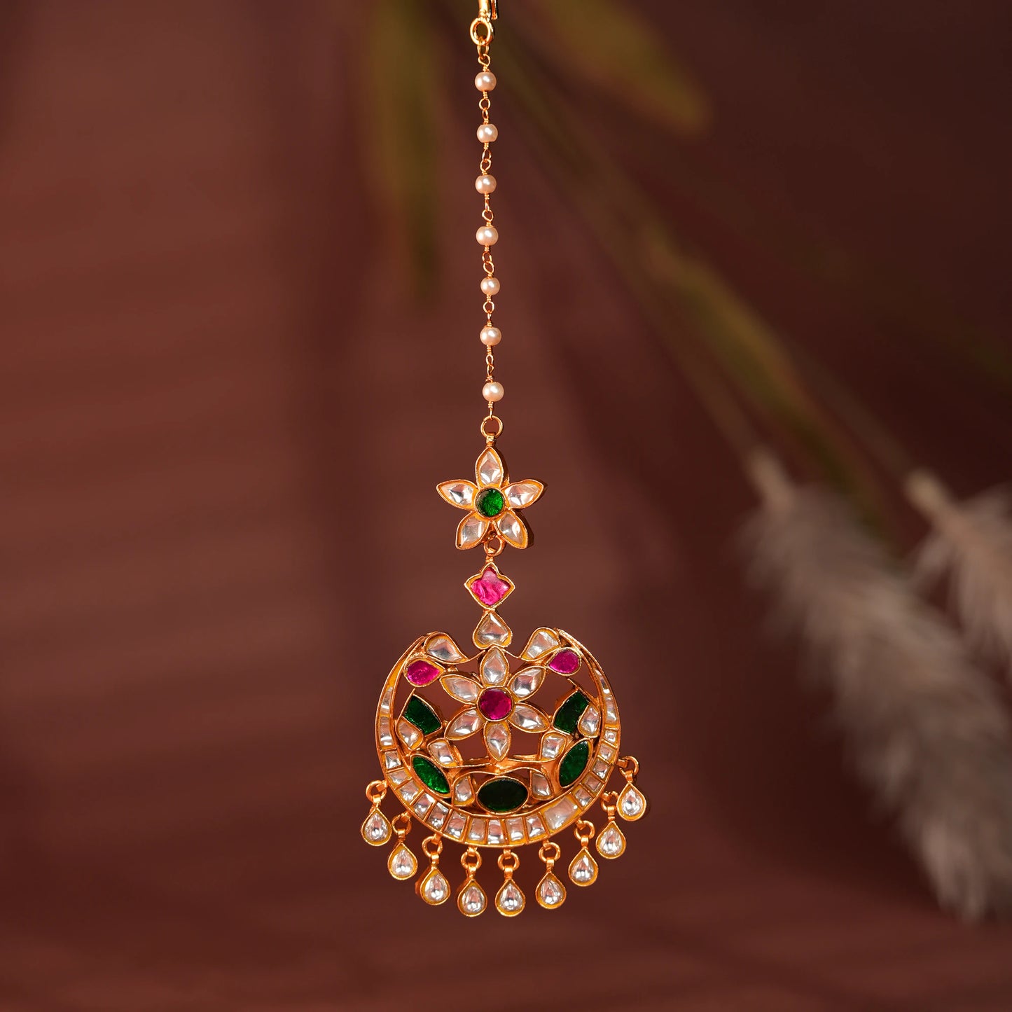 green floral with green sttone work maangtikka