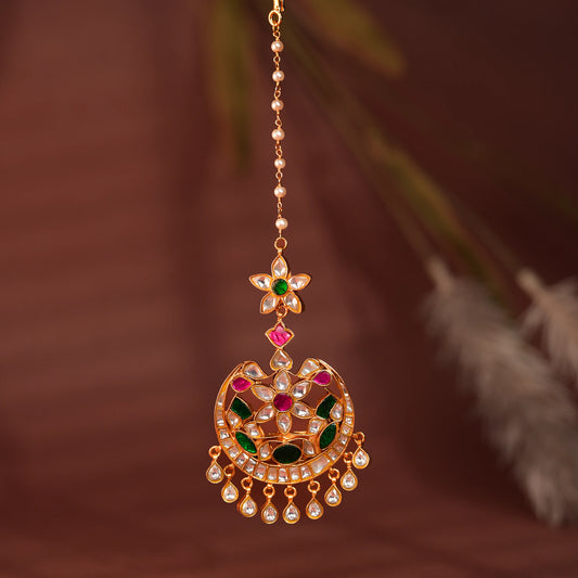 green floral with green sttone work maangtikka