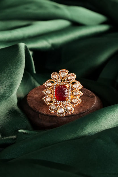 gold Plated ring with a central carved red gemstone