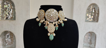 Choker set studded with jadtar stones beadded with pearl and sea green beads