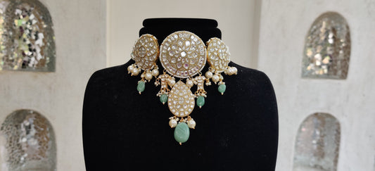 Choker set studded with jadtar stones beadded with pearl and sea green beads