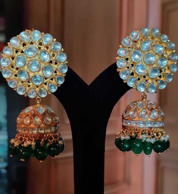 white jadtar stone big tops with jhumki in green hangings