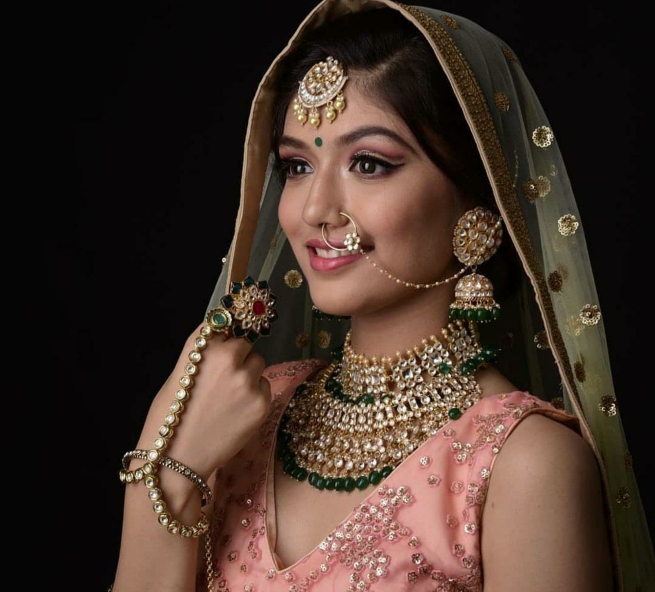 white jadtar stone big tops with jhumki in green hangings